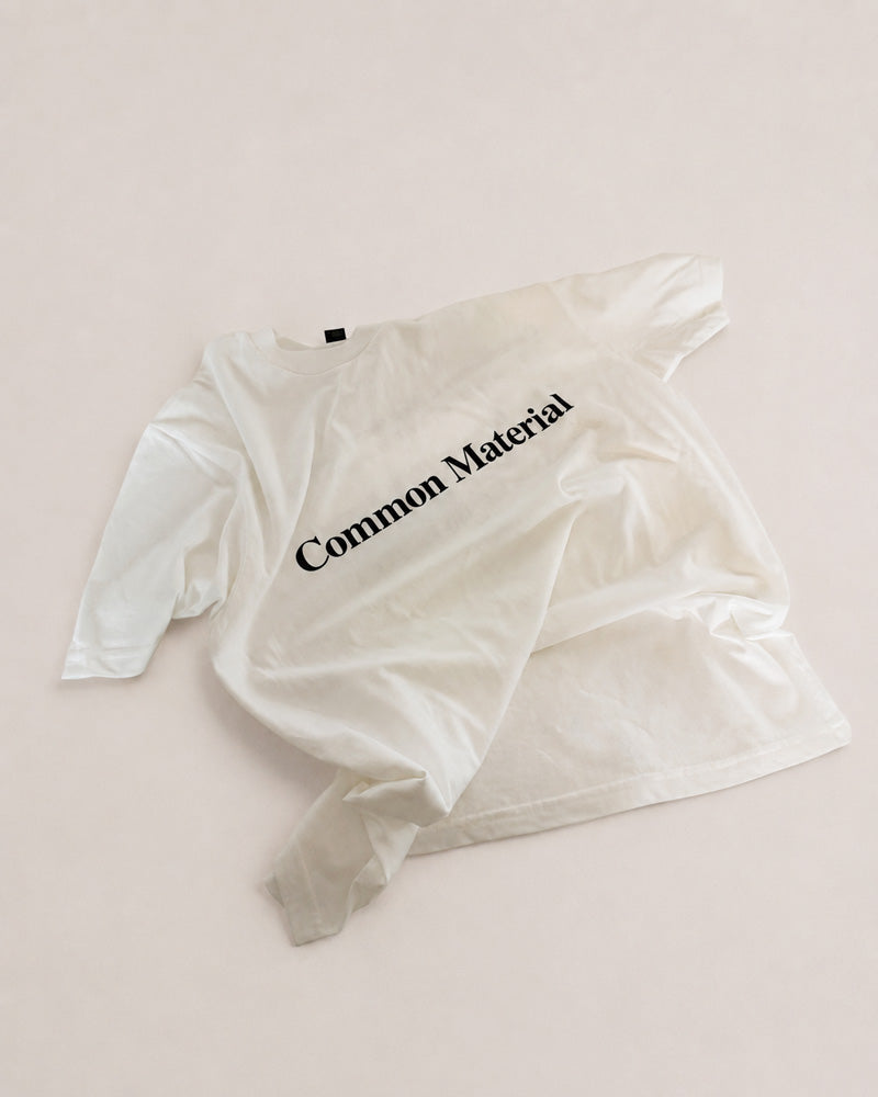white t-shirt with black print on white background
