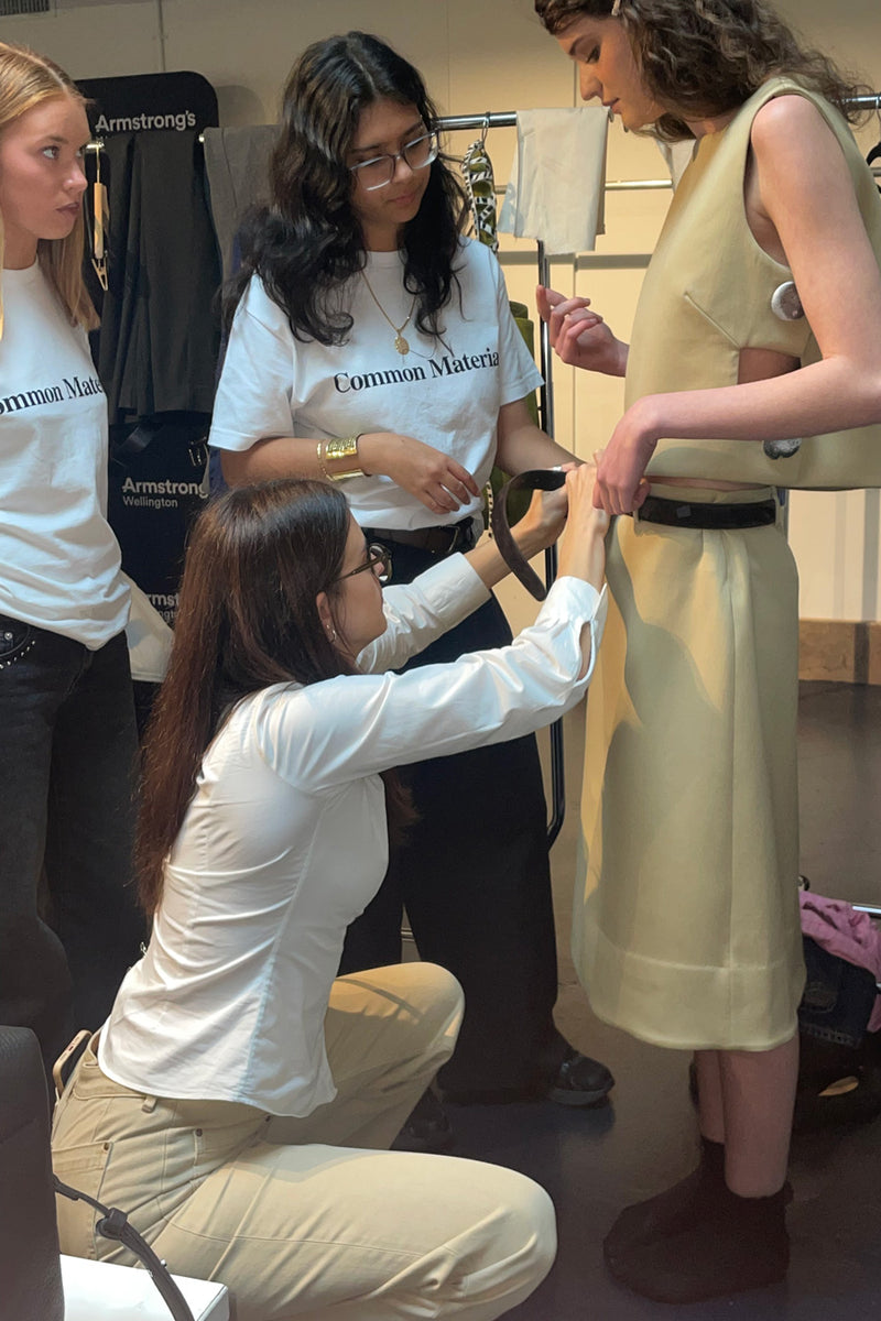 A group of designers preparing a model