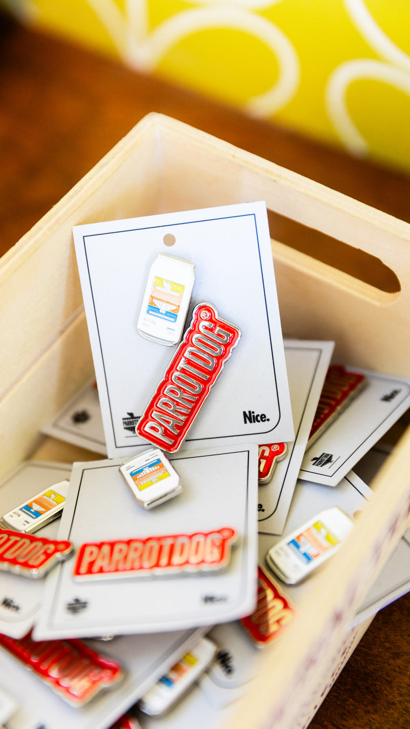 basket of enamel pins