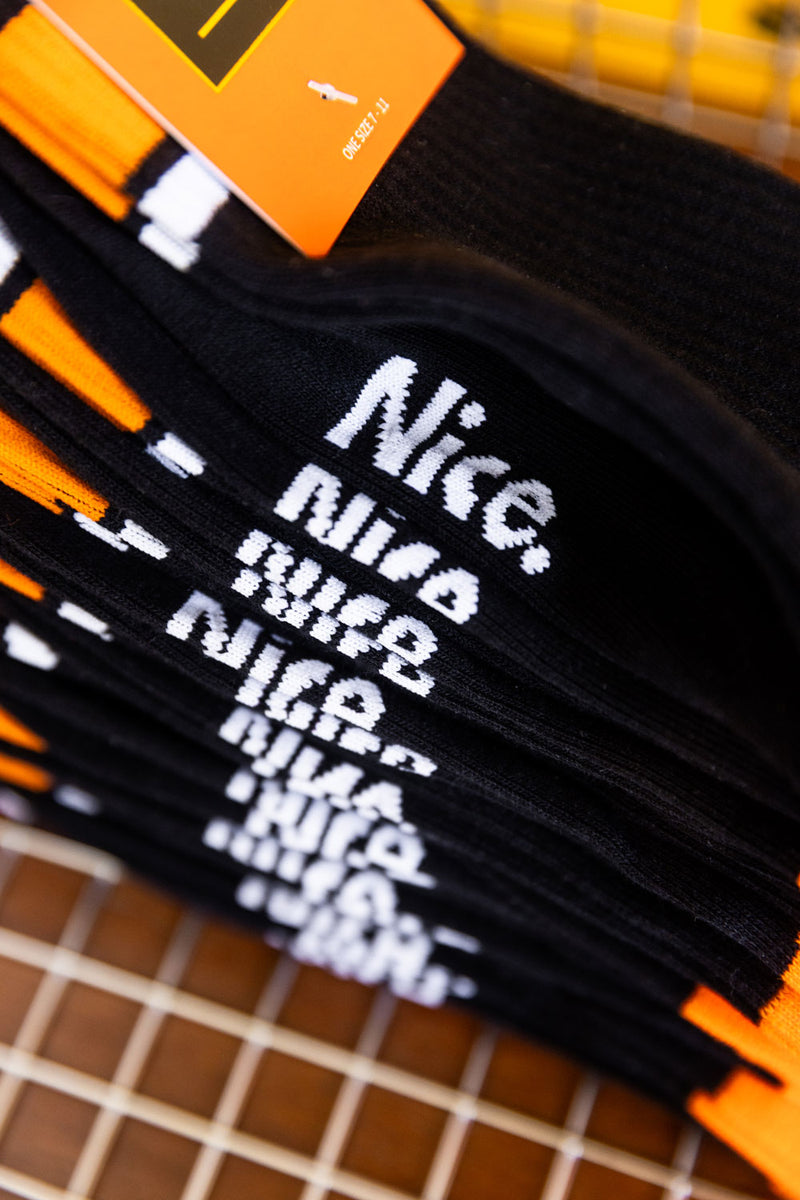 Black abd orange socks stacked up