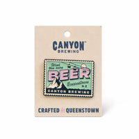 Greena nd pink pin on a piece of card