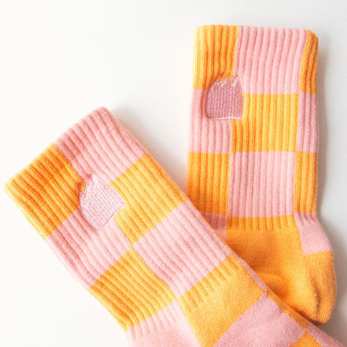 Pair of pink and orange checkered socks 